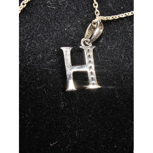 220 - A 925 silver pendant necklace featuring a silver letter H pendant set with sparkly crystal CZ stones... 