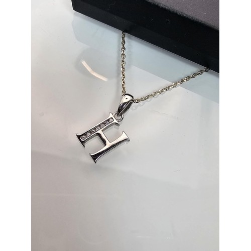 220 - A 925 silver pendant necklace featuring a silver letter H pendant set with sparkly crystal CZ stones... 