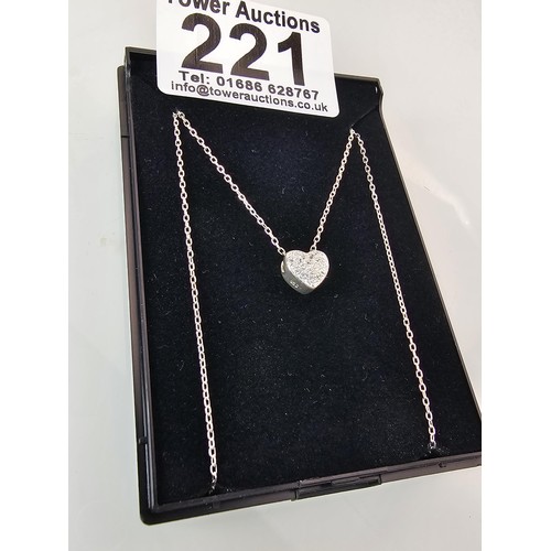 221 - An elegant 25 silver pendant necklace, featuring a silver heart shaped pedant, set with sparkly crys... 