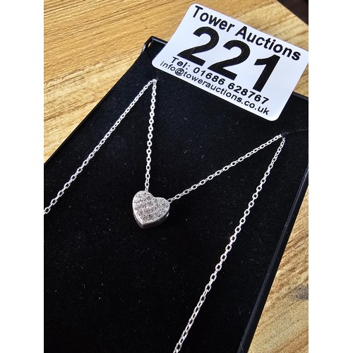 221 - An elegant 25 silver pendant necklace, featuring a silver heart shaped pedant, set with sparkly crys... 