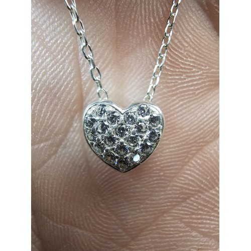 221 - An elegant 25 silver pendant necklace, featuring a silver heart shaped pedant, set with sparkly crys... 