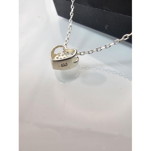 221 - An elegant 25 silver pendant necklace, featuring a silver heart shaped pedant, set with sparkly crys... 