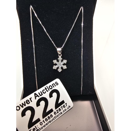222 - An attractive as new 925 silver pendant necklace featuring a snowflake formed pendant, set with spar... 