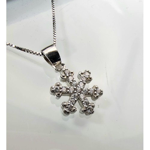 222 - An attractive as new 925 silver pendant necklace featuring a snowflake formed pendant, set with spar... 