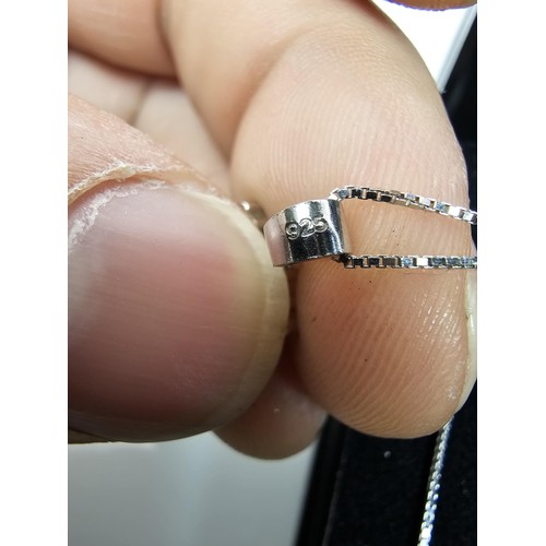 222 - An attractive as new 925 silver pendant necklace featuring a snowflake formed pendant, set with spar... 