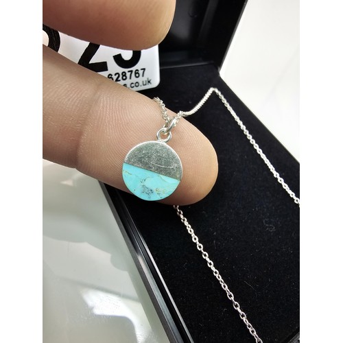 223 - A designer 925 silver pedant necklace by Oliver Bonas featuring a silver disk pendant, set with a tu... 