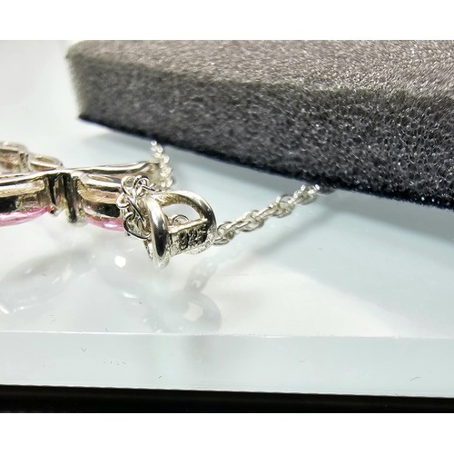 224 - An attractive as new unused 925 silver pendant necklace featuring a Cross formed pendant set with pi... 