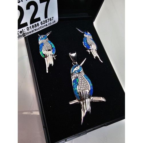 227 - A stunning unused 925 silver opal matching jewellery set featuring a kingfisher formed pendant inset... 
