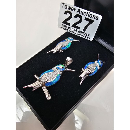 227 - A stunning unused 925 silver opal matching jewellery set featuring a kingfisher formed pendant inset... 