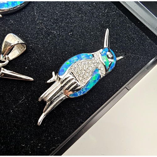 227 - A stunning unused 925 silver opal matching jewellery set featuring a kingfisher formed pendant inset... 