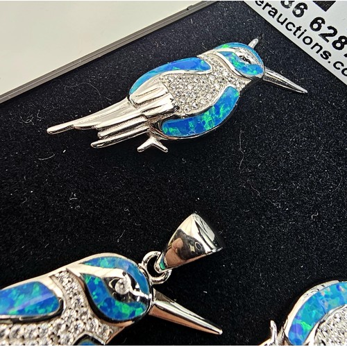 227 - A stunning unused 925 silver opal matching jewellery set featuring a kingfisher formed pendant inset... 
