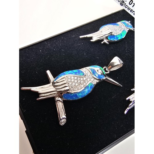 227 - A stunning unused 925 silver opal matching jewellery set featuring a kingfisher formed pendant inset... 