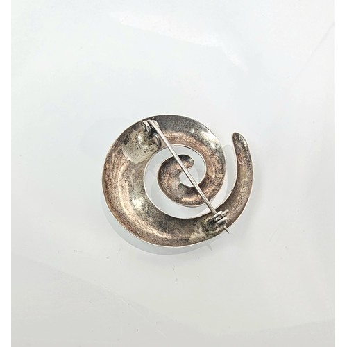 228 - A large 925 silver spiral formed brooch in good order, along with a 925 silver mounted pendant, havi... 