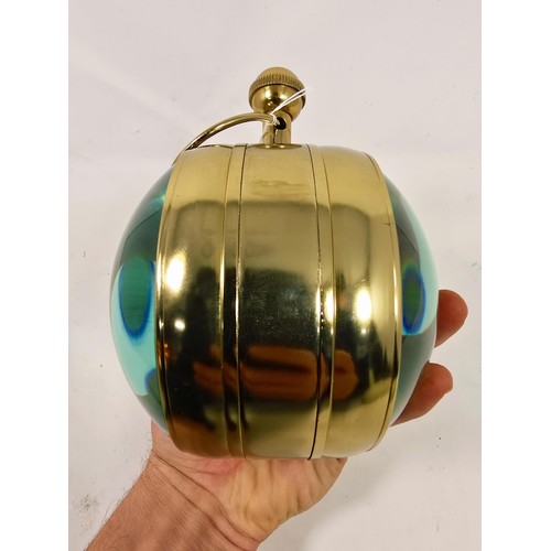 197 - An attractive large Eye of Time globe clock having thick magnified glass to both sides with advertis... 