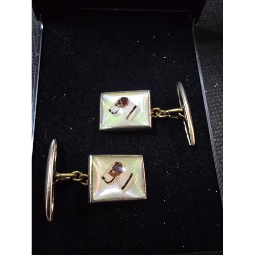 201 - A vintage attractive pair of 1930's Essex crystal style cuff links, featuring a dogs head which is r... 