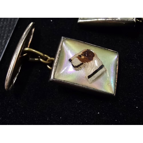 201 - A vintage attractive pair of 1930's Essex crystal style cuff links, featuring a dogs head which is r... 