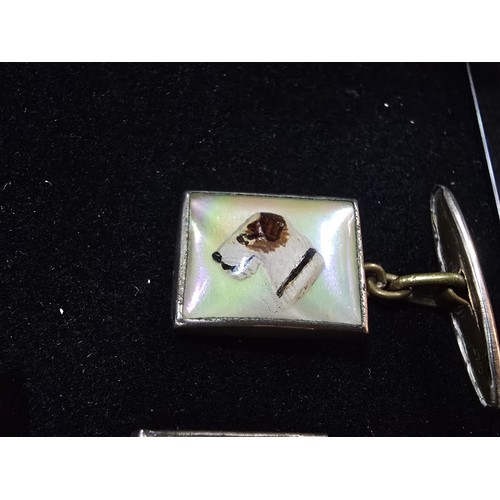 201 - A vintage attractive pair of 1930's Essex crystal style cuff links, featuring a dogs head which is r... 