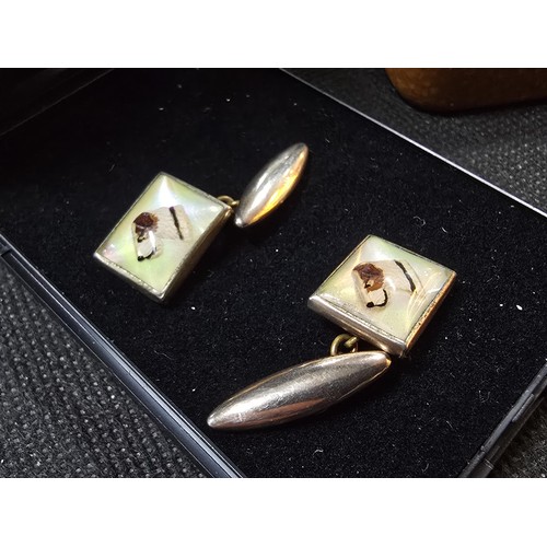 201 - A vintage attractive pair of 1930's Essex crystal style cuff links, featuring a dogs head which is r... 