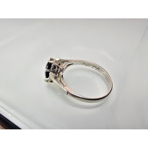 202 - A good quality vintage hallmarked silver solitaire ring set with a large round cut faceted garnet ge... 