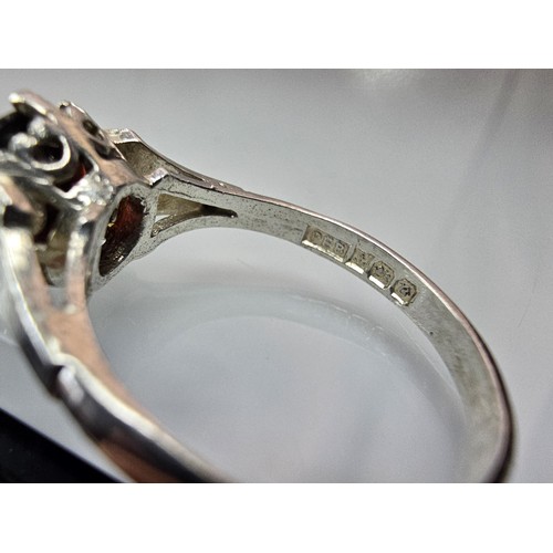 202 - A good quality vintage hallmarked silver solitaire ring set with a large round cut faceted garnet ge... 