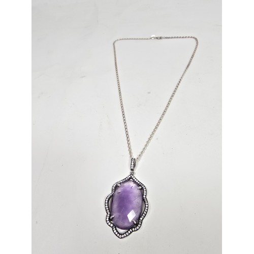 204 - A good quality 925 silver pendant necklace featuring a large silver pendant, set with a large oval f... 