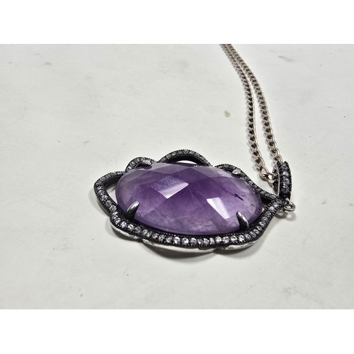 204 - A good quality 925 silver pendant necklace featuring a large silver pendant, set with a large oval f... 