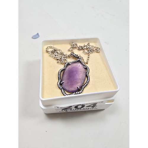204 - A good quality 925 silver pendant necklace featuring a large silver pendant, set with a large oval f... 