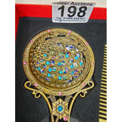 198 - 2x boxed as new collectables, to include a very attractive hand mirror and comb set, the mirror has ... 