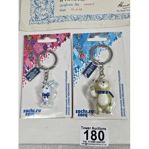 180 - A box of collectables, to include a quantity of 2018 Fifa World Cup Russia keyrings and pin badges, ... 