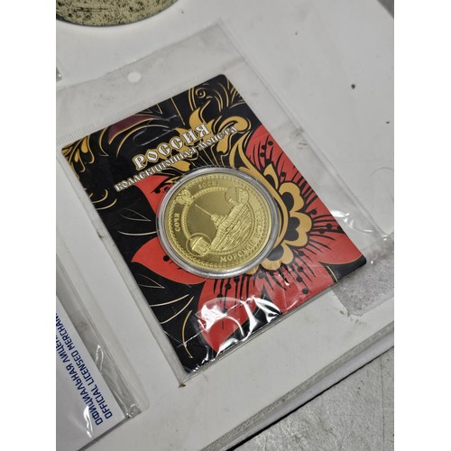 180 - A box of collectables, to include a quantity of 2018 Fifa World Cup Russia keyrings and pin badges, ... 
