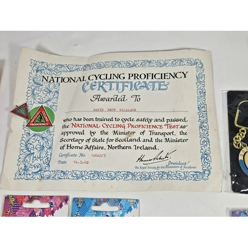 180 - A box of collectables, to include a quantity of 2018 Fifa World Cup Russia keyrings and pin badges, ... 