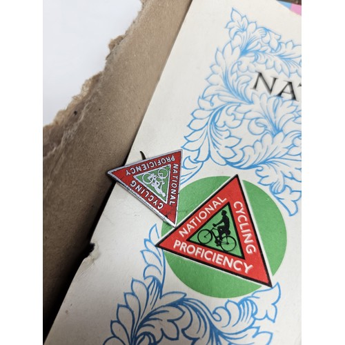 180 - A box of collectables, to include a quantity of 2018 Fifa World Cup Russia keyrings and pin badges, ... 
