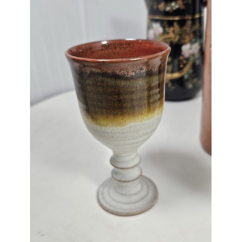 181 - A quantity of collectable ceramics, to include a set of 3 graduated handpainted black jugs, with a f... 
