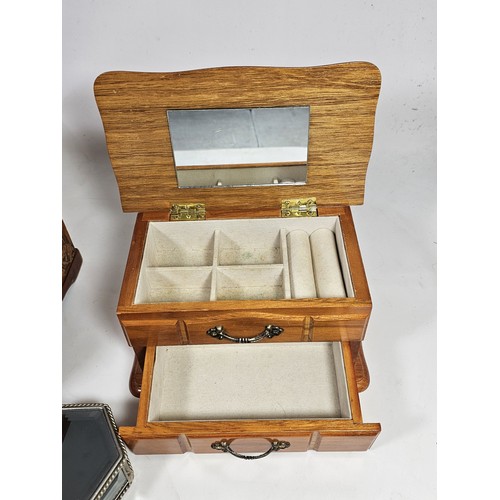 182 - A collection of 3 trinket boxes, to include a 2 drawer trinket box with a champagne design, a 2 draw... 