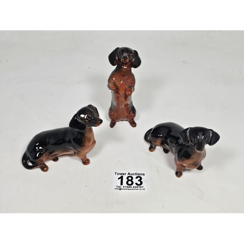 183 - A collection of 3 Beswick ceramic dachshund figurines, each modelled in characteristic poses with a ... 