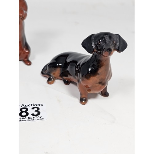 183 - A collection of 3 Beswick ceramic dachshund figurines, each modelled in characteristic poses with a ... 
