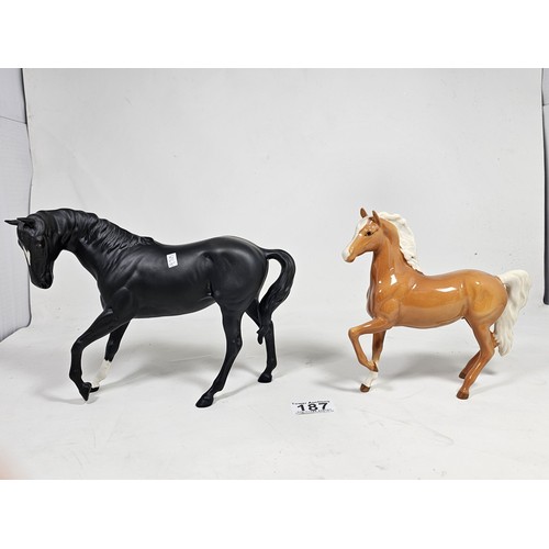 187 - A pair of Beswick horse figures, to include a Black Beauty figure in matte black with no chips or ol... 