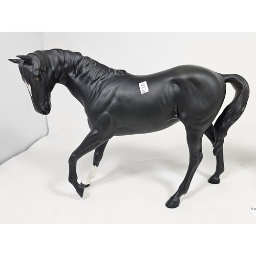 187 - A pair of Beswick horse figures, to include a Black Beauty figure in matte black with no chips or ol... 