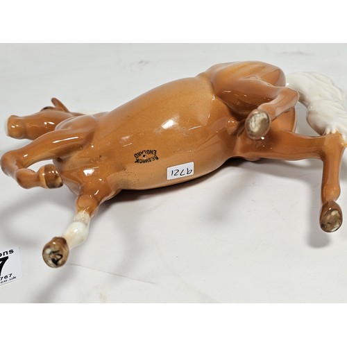 187 - A pair of Beswick horse figures, to include a Black Beauty figure in matte black with no chips or ol... 