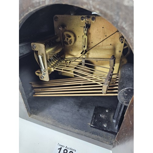 188 - An ornate Art Deco club shaped mantel clock with Whittington and Westminster chimes, appears to be i... 