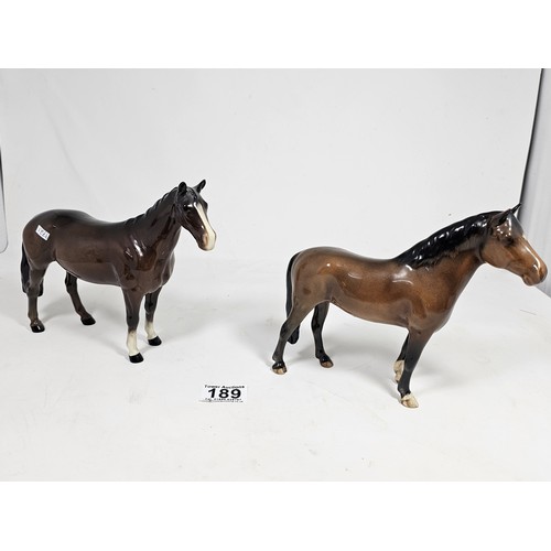 189 - A pair of Beswick Bay horses, 1 of the lighter coloured horses is stamped New Forest with an old rep... 