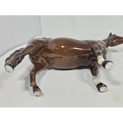 189 - A pair of Beswick Bay horses, 1 of the lighter coloured horses is stamped New Forest with an old rep... 