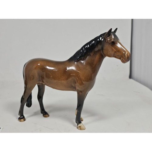 189 - A pair of Beswick Bay horses, 1 of the lighter coloured horses is stamped New Forest with an old rep... 