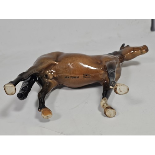 189 - A pair of Beswick Bay horses, 1 of the lighter coloured horses is stamped New Forest with an old rep... 
