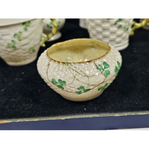 190 - A collection of 7 pieces of Belleek items, to include 3 cups with the iconic clover leaf design and ... 