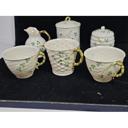 190 - A collection of 7 pieces of Belleek items, to include 3 cups with the iconic clover leaf design and ... 