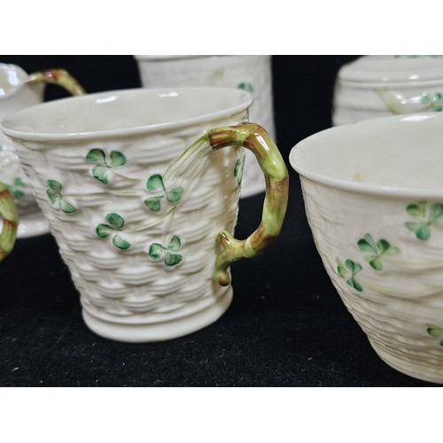 190 - A collection of 7 pieces of Belleek items, to include 3 cups with the iconic clover leaf design and ... 