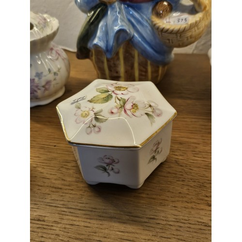 193 - A collection of collectable trinket boxes of varying makes and designs to include a wade trinket box... 