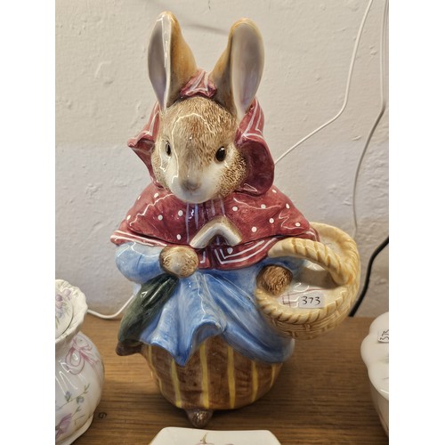 193 - A collection of collectable trinket boxes of varying makes and designs to include a wade trinket box... 