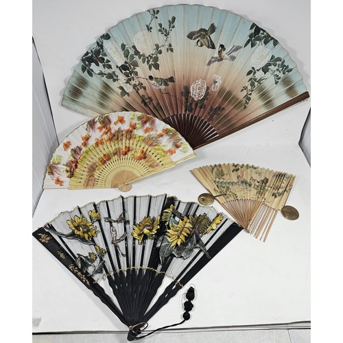 194 - A collection of 4x good quality oriental fans to include a black lace fan with hand stitched floral ... 